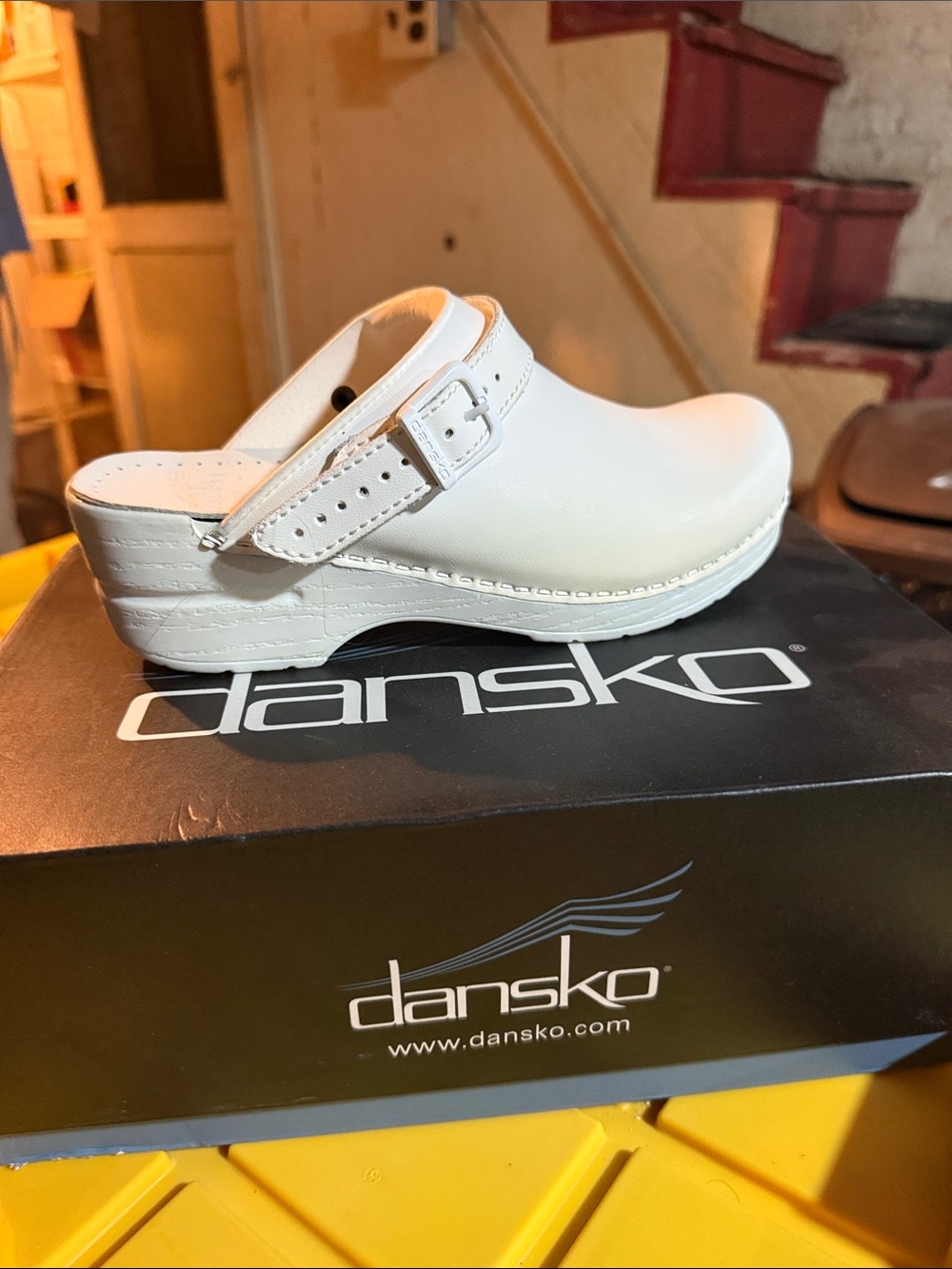 Dansko White Leather Slip-On Clog with Buckle Strap